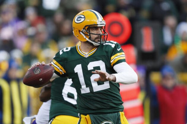 Green Bay Packers' Aaron Rodgers throws during the first half of an NFL football game against the Minnesota Vikings Saturday, Dec. 24, 2016, in Green Bay, Wis. (AP Photo/Matt Ludtke)