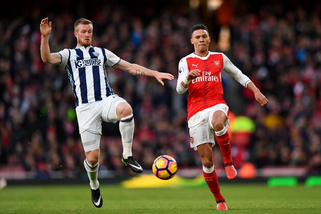 LONDON, ENGLAND - DECEMBER 26:  Kieran Gibbs of Arsenal battles for the ball with Chris Brunt of West Bromwich Albion during the Premier League match between Arsenal and West Bromwich Albion at Emirates Stadium on December 26, 2016 in London, England.  (Photo by Shaun Botterill/Getty Images)