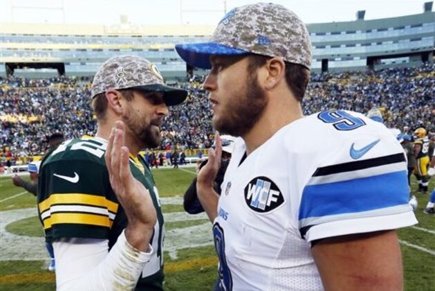 FILE - In this Nov. 15, 2015 file photo, Green Bay Packers' Aaron Rodgers talks to Detroit Lions' Matthew Stafford after an NFL football game in Green Bay, Wis.  Rodgers has been struggling a bit this season while Stafford is in one of his best grooves. The quarterback  who plays best Thursday, Dec. 3 will likely help his team win at Ford Field. (AP Photo/Mike Roemer)