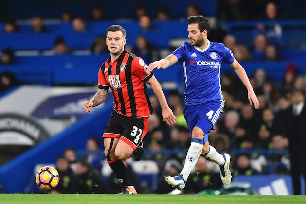 Bournemouth's English midfielder Jack Wilshere (L) runs by Chelsea's Spanish midfielder Cesc Fabregas (R) during the English Premier League football match between Chelsea and Bournemouth at Stamford Bridge in London on December 26, 2016. / AFP / Glyn KIRK / RESTRICTED TO EDITORIAL USE. No use with unauthorized audio, video, data, fixture lists, club/league logos or 'live' services. Online in-match use limited to 75 images, no video emulation. No use in betting, games or single club/league/player publications.  /         (Photo credit should read GLYN KIRK/AFP/Getty Images)