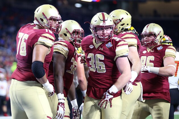 DETROIT, MI - DECEMBER 26: Jon Hilliman #32 of the Boston College Eagles celebrates a touchdown run with his teammates during the first quarter of the game against the Maryland Terrapins at Ford Field on December 26, 2016 in Detroit, Michigan. (Photo by Leon Halip/Getty Images)