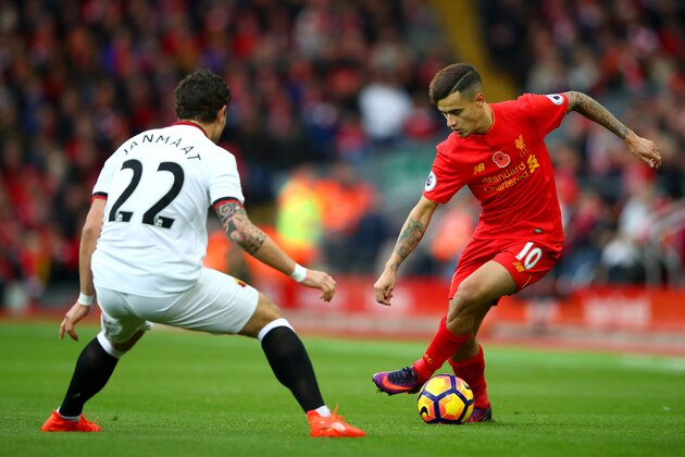 LIVERPOOL, ENGLAND - NOVEMBER 06: Philippe Coutinho of Liverpool takes on Daryl Janmaat of Watford  during the Premier League match between Liverpool and Watford at Anfield on November 6, 2016 in Liverpool, England.  (Photo by Clive Brunskill/Getty Images)