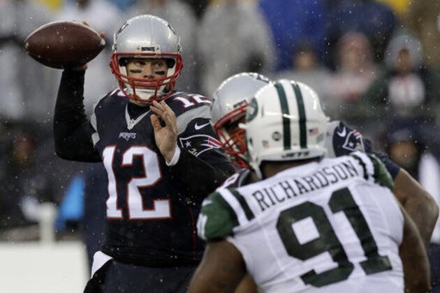 New England Patriots quarterback Tom Brady (12) passes under pressure from New York Jets defensive end Sheldon Richardson (91) during the first half of an NFL football game, Saturday, Dec. 24, 2016, in Foxborough, Mass. (AP Photo/Charles Krupa)