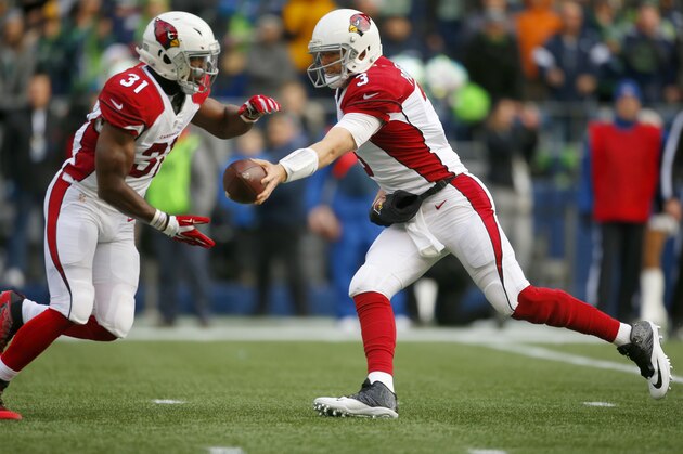 SEATTLE, WA - DECEMBER 24:  Quarterback Carson Palmer #3 of the Arizona Cardinals hands off to running back David Johnson #31 against the Seattle Seahawks at CenturyLink Field on December 24, 2016 in Seattle,Washington.  (Photo by Otto Greule Jr/Getty Images)