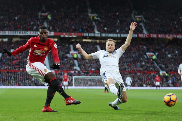 MANCHESTER, ENGLAND - DECEMBER 26: Paul Pogba of Manchester United and Sebastian Larsson of Sunderland during the Premier League match between Manchester United and Sunderland at Old Trafford on December 26, 2016 in Manchester, England. (Photo by James Baylis - AMA/Getty Images)