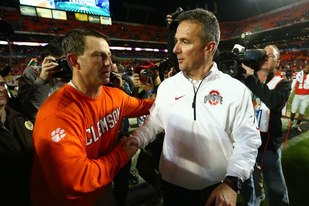 MIAMI GARDENS, FL - JANUARY 03: Head coach Dabo Swinney of the Clemson Tigers (L) and head coach Urban Meyer of the Ohio State Buckeyes shake hands after the the Discover Orange Bowl at Sun Life Stadium on January 3, 2014 in Miami Gardens, Florida. Clemson defeated Ohio State 40-35. (Photo by Streeter Lecka/Getty Images)