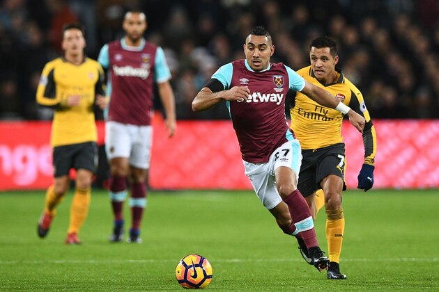 West Ham United's French midfielder Dimitri Payet runs with the ball during the English Premier League football match between West Ham United and Arsenal at The London Stadium, in east London on December 3, 2016. / AFP / Justin TALLIS / RESTRICTED TO EDITORIAL USE. No use with unauthorized audio, video, data, fixture lists, club/league logos or 'live' services. Online in-match use limited to 75 images, no video emulation. No use in betting, games or single club/league/player publications.  /         (Photo credit should read JUSTIN TALLIS/AFP/Getty Images)