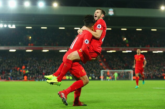 LIVERPOOL, ENGLAND - DECEMBER 27:  Roberto Firmino of Liverpool (L) celebrates with Adam Lallana as he scores their second goal during the Premier League match between Liverpool and Stoke City at Anfield on December 27, 2016 in Liverpool, England.  (Photo by Alex Livesey/Getty Images)