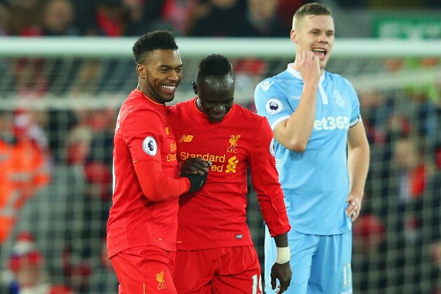 LIVERPOOL, ENGLAND - DECEMBER 27:  Ryan Shawcross of Stoke City (R) looks dejected as Daniel Sturridge of Liverpool (L) celebrates with team mates Sadio Mane as he scores their fourth goal during the Premier League match between Liverpool and Stoke City at Anfield on December 27, 2016 in Liverpool, England.  (Photo by Alex Livesey/Getty Images)