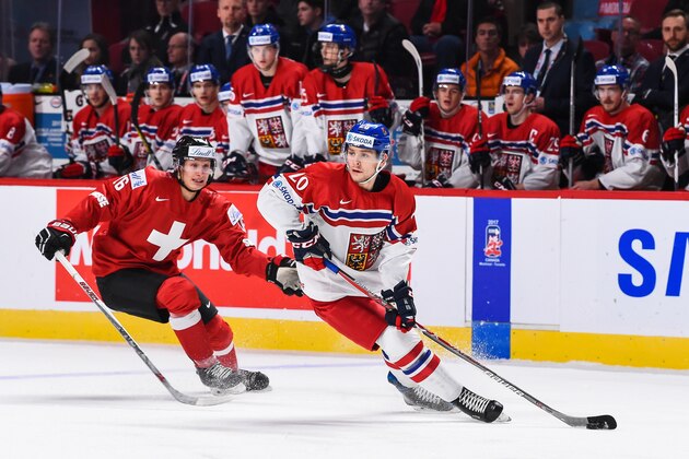 MONTREAL, QC - DECEMBER 27:  Jakub Zboril #20 of Team Czech Republic skates the puck against Loic In-Albon #16 of Team Switzerland during the IIHF World Junior Championship preliminary round game at the Bell Centre on December 27, 2016 in Montreal, Quebec, Canada.  (Photo by Minas Panagiotakis/Getty Images)