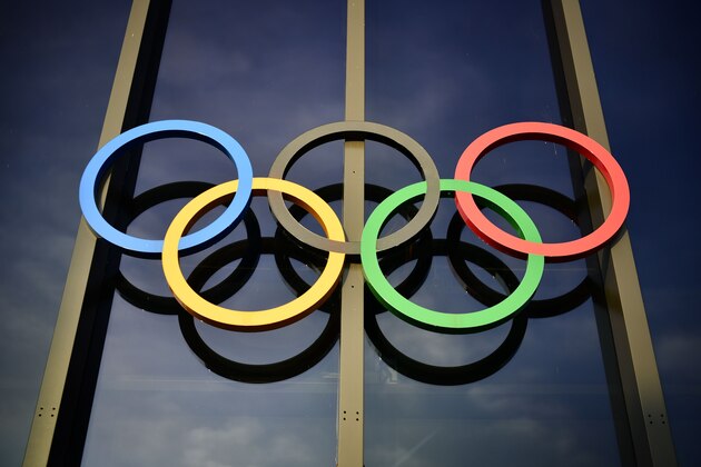 The Olympic rings are seen above the entrance on the facade of the Olympic Museum in Lausanne, Switzerland, on December 7, 2016. / AFP / FABRICE COFFRINI        (Photo credit should read FABRICE COFFRINI/AFP/Getty Images)