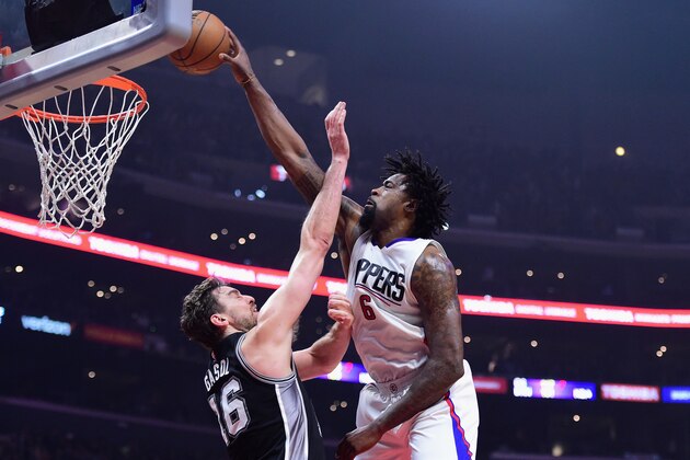 LOS ANGELES, CA - DECEMBER 22:  DeAndre Jordan #6 of the Los Angeles Clippers dunks the ball over Pau Gasol #16 of the San Antonio Spurs during the game at Staples Center on December 22, 2016 in Los Angeles, California.  (Photo by Harry How/Getty Images)