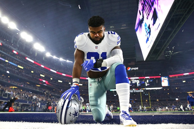 ARLINGTON, TX - DECEMBER 26: Ezekiel Elliott #21 of the Dallas Cowboys takes a knee in the end zone before the Cowboys played the Detroit Lions at AT&T Stadium on December 26, 2016 in Arlington, Texas. (Photo by Tom Pennington/Getty Images)