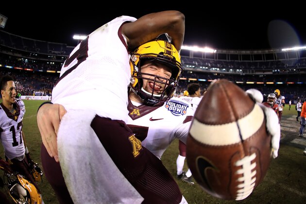 SAN DIEGO, CA - DECEMBER 27:  Mitch Leidner #7 and Eric Carter #9 of the Minnesota Golden Gophers celebrate defeating Washington State Cougars 17-12 in the Holiday Bowl at at Qualcomm Stadium on December 27, 2016 in San Diego, California.  (Photo by Sean M. Haffey/Getty Images)