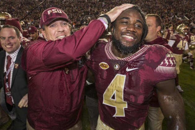 FILE - In this Nov. 26, 2016, file photo, Florida State coach Jimbo Fisher and running back Dalvin Cook celebrate the team's 31-13 win over Florida in an NCAA college football game in Tallahassee, Fla. Cook was selected to the 2016 AP All-America college football team, Monday, Dec. 12, 2016. (AP Photo/Mark Wallheiser, File)