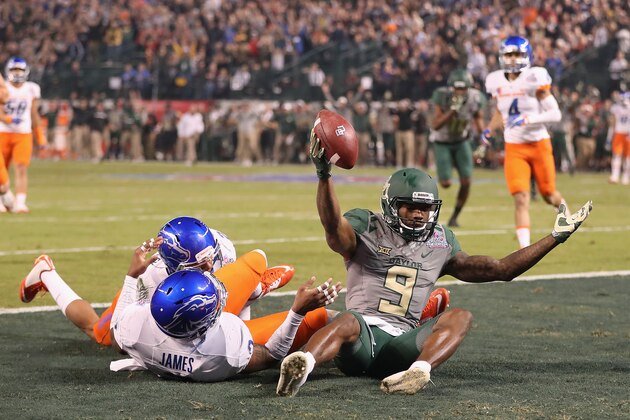PHOENIX, AZ - DECEMBER 27:  Wide receiver KD Cannon #9 of the Baylor Bears reacts after scoring on a 30 yard touchdown reception past safety Chanceller James #3 of the Boise State Broncos during the first quarter of the Motel 6 Cactus Bowl at Chase Field on December 27, 2016 in Phoenix, Arizona.  (Photo by Christian Petersen/Getty Images)