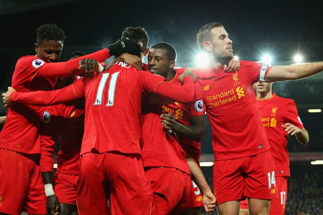 LIVERPOOL, ENGLAND - DECEMBER 27:  Roberto Firmino of Liverpool (11) celebrates with team mates as he scores their second goal during the Premier League match between Liverpool and Stoke City at Anfield on December 27, 2016 in Liverpool, England.  (Photo by Alex Livesey/Getty Images)