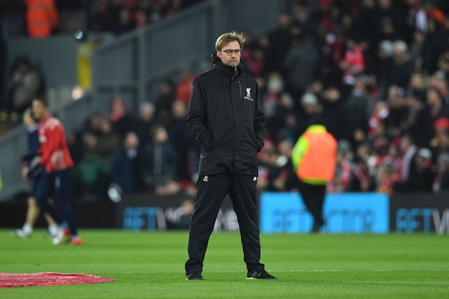 Liverpool's German manager Jurgen Klopp stands on the pitch during the warm up ahead of the English Premier League football match between Liverpool and Stoke City at Anfield in Liverpool, north west England on December 27, 2016. / AFP / Paul ELLIS / RESTRICTED TO EDITORIAL USE. No use with unauthorized audio, video, data, fixture lists, club/league logos or 'live' services. Online in-match use limited to 75 images, no video emulation. No use in betting, games or single club/league/player publications.  /         (Photo credit should read PAUL ELLIS/AFP/Getty Images)