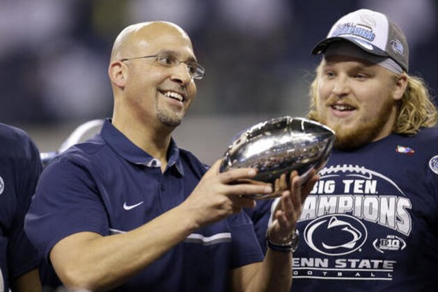 Penn State head coach James Franklin holds the trophy after defeating Wisconsin to with the Big Ten championship NCAA college football game Sunday, Dec. 4, 2016, in Indianapolis. Penn State won 38-31. (AP Photo/AJ Mast)