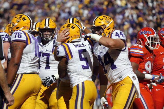 LSU running back Derrius Guice (5) celebrates his rushing touchdown with teammates in the first half an NCAA college football game against Florida in Baton Rouge, La., Saturday, Nov. 19, 2016. (AP Photo/Gerald Herbert)