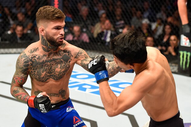 LAS VEGAS, NV - AUGUST 20:  Cody Garbrandt punches Takeya Mizugaki of Japan in their bantamweight bout during the UFC 202 event at T-Mobile Arena on August 20, 2016 in Las Vegas, Nevada.  (Photo by Josh Hedges/Zuffa LLC/Zuffa LLC via Getty Images)