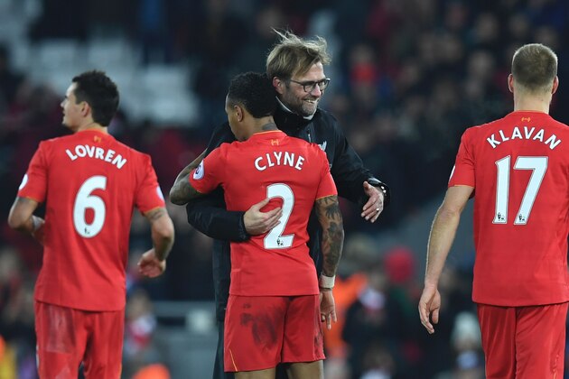 Liverpool's German manager Jurgen Klopp (2R) embraces Liverpool's English defender Nathaniel Clyne (2L) during the English Premier League football match between Liverpool and Stoke City at Anfield in Liverpool, north west England on December 27, 2016. / AFP / Paul ELLIS / RESTRICTED TO EDITORIAL USE. No use with unauthorized audio, video, data, fixture lists, club/league logos or 'live' services. Online in-match use limited to 75 images, no video emulation. No use in betting, games or single club/league/player publications.  /         (Photo credit should read PAUL ELLIS/AFP/Getty Images)