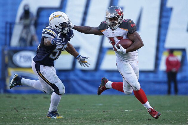 SAN DIEGO, CA - DECEMBER 04:  Doug Martin #22 of the Tampa Bay Buccaneers  carries the ball while being pursued by Denzel Perryman #52 of the San Diego Chargers in the third quarter at Qualcomm Stadium on December 4, 2016 in San Diego, California. The Buccaneers defeated the Chargers 28-21.  (Photo by Jeff Gross/Getty Images)