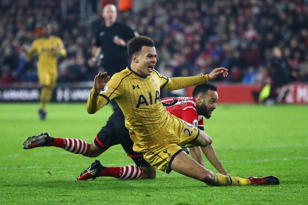 SOUTHAMPTON, ENGLAND - DECEMBER 28:  Nathan Redmond of Southampton fouls Dele Alli of Tottenham Hotspur to concede a penalty and is sent off during the Premier League match between Southampton and Tottenham Hotspur at St Mary's Stadium on December 28, 2016 in Southampton, England.  (Photo by Julian Finney/Getty Images)
