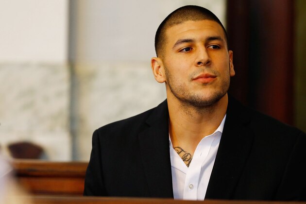 NORTH ATTLEBORO, MA - AUGUST 22: Aaron Hernandez sits in the courtroom of the Attleboro District Court during his hearing on August 22, 2013 in North Attleboro, Massachusetts. Former New England Patriot Aaron Hernandez has been indicted on a first-degree murder charge for the death of Odin Lloyd. (Photo by Jared Wickerham/Getty Images)