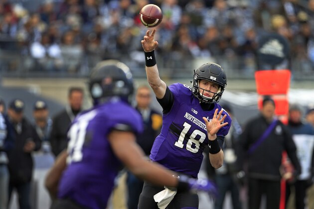 NEW YORK, NY - DECEMBER 28: Quarterback Clayton Thorson #18 of the Northwestern Wildcats passes the ball to running back Justin Jackson #21 during the first half of the New Era Pinstripe Bowl against the Pittsburgh Panthers at Yankee Stadium on December 28, 2016 in the Bronx borough of New York City. (Photo by Adam Hunger/Getty Images)