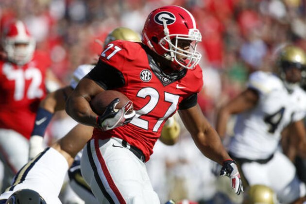 Georgia running back Nick Chubb (27) runs the ball against Georgia Tech in the first half of an NCAA college football game Saturday, Nov. 26, 2016, in Athens, Ga. (AP Photo/Brett Davis)