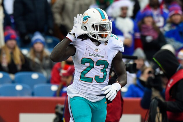ORCHARD PARK, NY - DECEMBER 24:  Jay Ajayi #23 of the Miami Dolphins gestures following his touchdown run against the Buffalo Bills during the first quarter at New Era Field on December 24, 2016 in Orchard Park, New York. The Miami Dolphins defeated the Buffalo Bills 34-31 in overtime. (Photo by Rich Barnes/Getty Images)