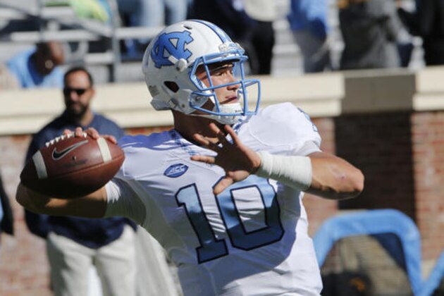 North Carolina quarterback Mitch Trubisky (10) warms up prior to the start of an NCAA college football game between North Carolina and Virginia at Scott stadium in Charlottesville, Va., Saturday, Oct. 22, 2016. (AP Photo/Steve Helber)