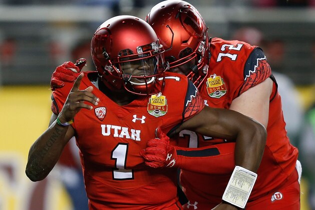 SANTA CLARA, CA - DECEMBER 28: Quarterback Tyler Huntley #1 of the Utah Utes celebrates with Garett Bolles #72 after scoring a touchdown during the Foster Farms Bowl game at Levi's Stadium on December 28, 2016 in Santa Clara, California. (Photo by Lachlan Cunningham/Getty Images)