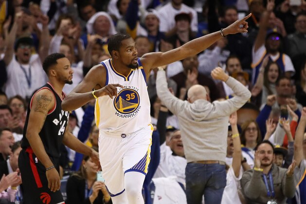 OAKLAND, CA - DECEMBER 28:  Kevin Durant #35 of the Golden State Warriors reacts during their game against the Toronto Raptors at ORACLE Arena on December 28, 2016 in Oakland, California.  NOTE TO USER: User expressly acknowledges and agrees that, by downloading and or using this photograph, User is consenting to the terms and conditions of the Getty Images License Agreement.  (Photo by Ezra Shaw/Getty Images)