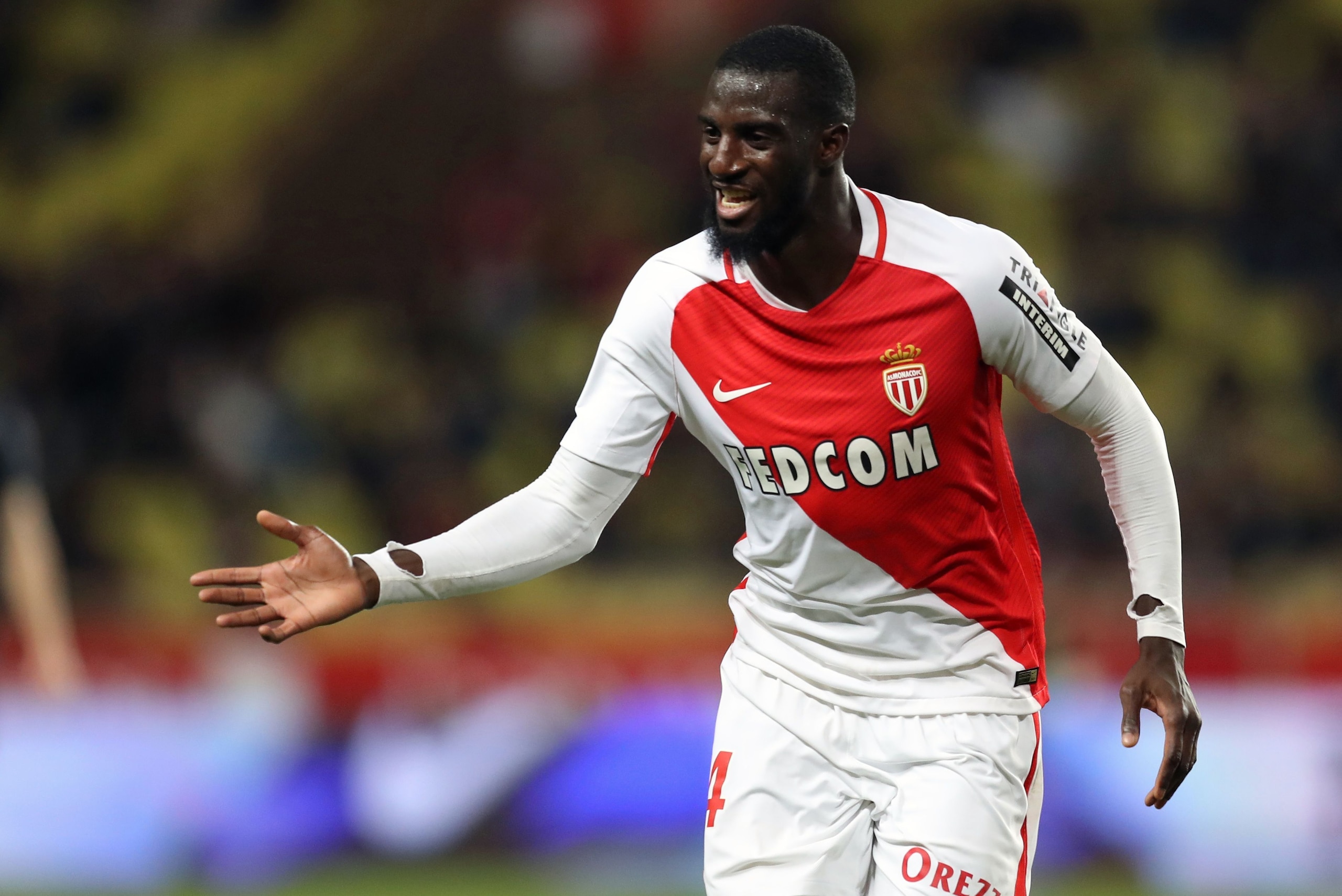 Monaco's French midfielder Tiemoue Bakayoko celebrates after scoring a goal during the French L1 football match between Monaco (ASM) and Caen (SMC) on December 21, 2016 at the Louis II Stadium in Monaco. / AFP / VALERY HACHE        (Photo credit should read VALERY HACHE/AFP/Getty Images)