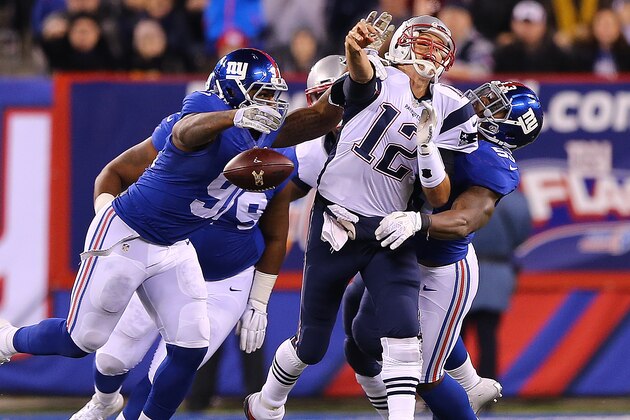 EAST RUTHERFORD, NJ - NOVEMBER 15: Tom Brady #12 of the New England Patriots fumbles the ball against the New York Giants during the fourth quarter at MetLife Stadium on November 15, 2015 in East Rutherford, New Jersey. The New England Patriots defeated the New York Giants 27-26.  (Photo by Elsa/Getty Images)