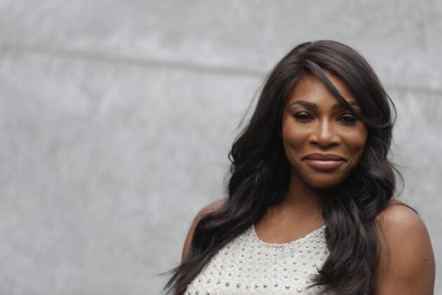 U.S. tennis star Serena Williams poses for photographers prior to the start of the Giorgio Armani women's Spring-Summer 2017 fashion show, that was presented in Milan, Italy, Friday, Sept. 23, 2016. (AP Photo/Luca Bruno)