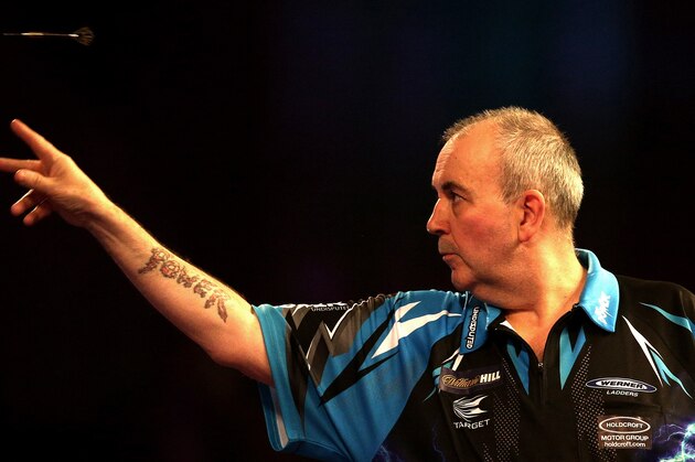 LONDON, ENGLAND - DECEMBER 18:  Phil Taylor of England throws during his first round match against David Platt of England  during Day Four of the 2017 William Hill PDC World Darts Championships  at Alexandra Palace on December 18, 2016 in London, England.  (Photo by Alex Pantling/Getty Images)