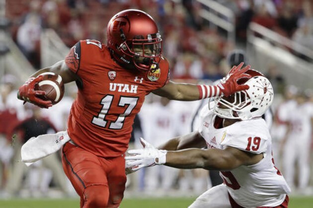 Utah wide receiver Demari Simpkins (17) stiff-arms Indiana defensive back Tony Fields (19) after a reception during the first half of the Foster Farms Bowl NCAA college football game Wednesday, Dec. 28, 2016, in Santa Clara, Calif. (AP Photo/Marcio Jose Sanchez)