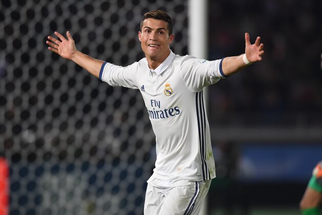 YOKOHAMA, JAPAN - DECEMBER 18:  Cristiano Ronaldo of Real Madrid celebrates scoring his team's fourth goal and his hat trick during the FIFA Club World Cup final match between Real Madrid and Kashima Antlers at International Stadium Yokohama on December 18, 2016 in Yokohama, Japan.  (Photo by Etsuo Hara/Getty Images)