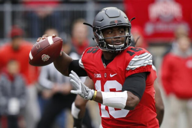 Ohio State quarterback J.T. Barrett drops back to pass against Michigan during the first half of an NCAA college football game Saturday, Nov. 26, 2016, in Columbus, Ohio. (AP Photo/Jay LaPrete)