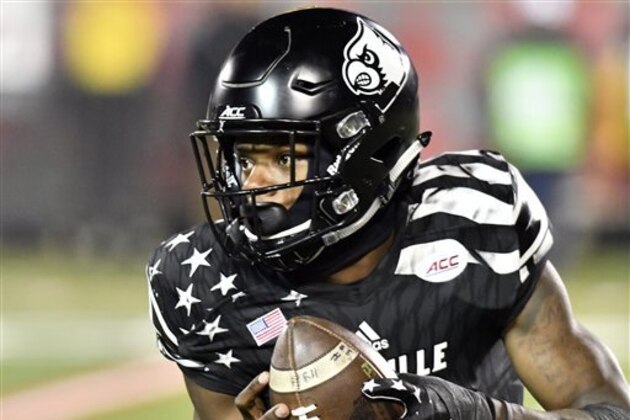 Louisville quarterback Lamar Jackson (8), attempts a run during the second half  of an NCAA college football game against Wake Forest, Saturday, Nov. 12, 2016 in Louisville Ky. Louisville won 44-12. (AP Photo/Timothy D. Easley)
