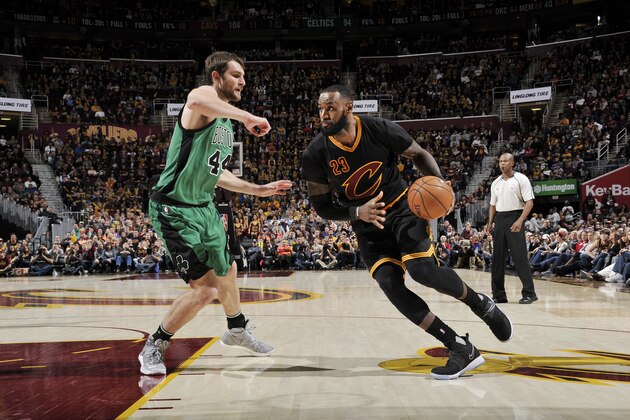CLEVELAND, OH - DECEMBER 29:  LeBron James #23 of the Cleveland Cavaliers drives to the basket against Tyler Zeller #44 of the Boston Celtics during a game on December 29, 2016 at Quicken Loans Arena in Cleveland, Ohio. NOTE TO USER: User expressly acknowledges and agrees that, by downloading and/or using this photograph, user is consenting to the terms and conditions of the Getty Images License Agreement. Mandatory Copyright Notice: Copyright 2016 NBAE (Photo by David Liam Kyle/NBAE via Getty Images)