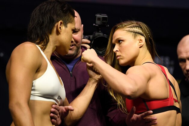 LAS VEGAS, NV - DECEMBER 29:  (L-R) UFC women's bantamweight champion Amanda Nunes of Brazil and Ronda Rousey face off during the UFC 207 weigh-in at T-Mobile Arena on December 29, 2016 in Las Vegas, Nevada. (Photo by Josh Hedges/Zuffa LLC/Zuffa LLC via Getty Images)