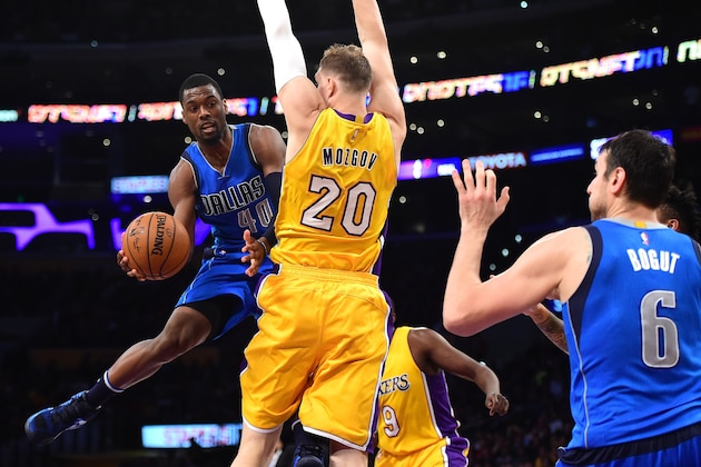 LOS ANGELES, CA - DECEMBER 29:  Harrison Barnes #40 of the Dallas Mavericks attempts a pass to Andrew Bogut #6 around Timofey Mozgov #20 of the Los Angeles Lakers during the first half at Staples Center on December 29, 2016 in Los Angeles, California.  NOTE TO USER: User expressly acknowledges and agrees that, by downloading and or using this photograph, User is consenting to the terms and conditions of the Getty Images License Agreement.  (Photo by Harry How/Getty Images)