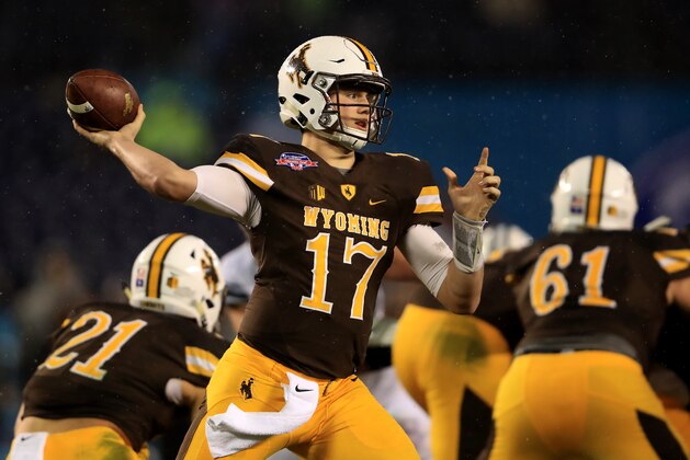 SAN DIEGO, CA - DECEMBER 21:  Josh Allen #17 of the Wyoming Cowboys passes the ball during the first half of the Poinsettia Bowl at Qualcomm Stadium on December 21, 2016 in San Diego, California.  (Photo by Sean M. Haffey/Getty Images)