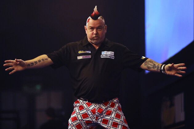 LONDON, ENGLAND - DECEMBER 30:  Peter Wright from Scotland celebrates after throwing a 180 during the quarter final of 2016 William Hill World Darts Championship on December 30, 2016 in London, England. The event is world's biggest darts tournament, with 72 players from across the globe competing across 15 days of the knock out competition.  (Photo by Dan Kitwood/Getty Images)