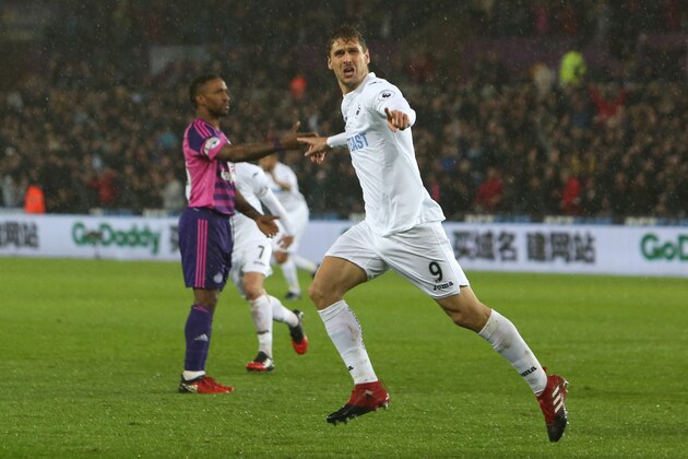 Swansea City's Spanish striker Fernando Llorente celebrates after scoring their second goal during the English Premier League football match between Swansea City and Sunderland at The Liberty Stadium in Swansea, south Wales on December 10, 2016. / AFP / Geoff CADDICK / RESTRICTED TO EDITORIAL USE. No use with unauthorized audio, video, data, fixture lists, club/league logos or 'live' services. Online in-match use limited to 75 images, no video emulation. No use in betting, games or single club/league/player publications.  /         (Photo credit should read GEOFF CADDICK/AFP/Getty Images)