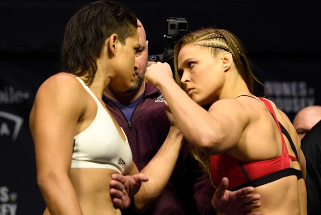 LAS VEGAS, NV - DECEMBER 29:  (L-R) UFC women's bantamweight champion Amanda Nunes of Brazil and Ronda Rousey face off during the UFC 207 weigh-in at T-Mobile Arena on December 29, 2016 in Las Vegas, Nevada. (Photo by Josh Hedges/Zuffa LLC/Zuffa LLC via Getty Images)